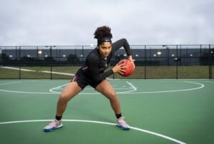 A Woman Holding a Basketball